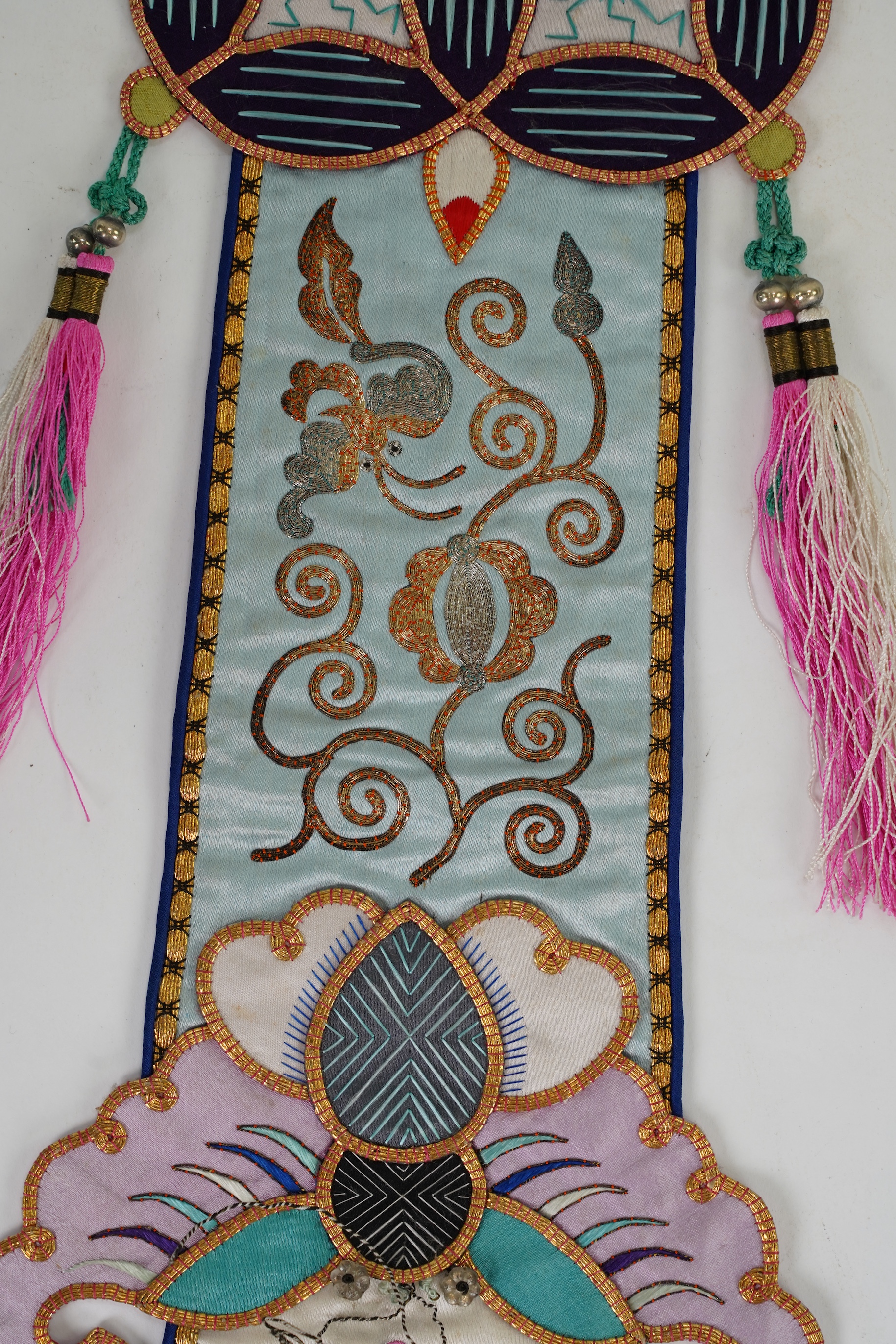 A pair of Chinese embroidered silk hanging pendants, early 20th century